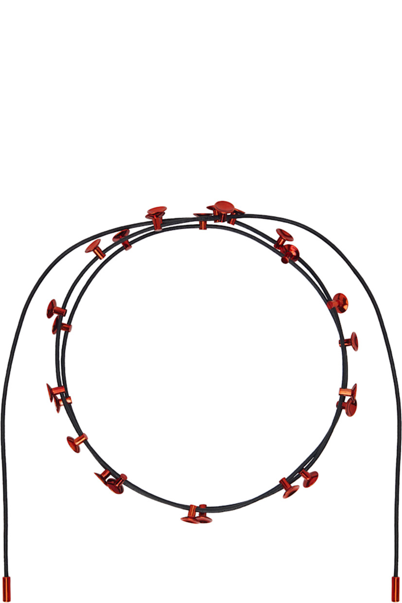 Wraparound leather cord necklace in black.

· Brass charms in red throughout
· Self-tie fastening
· L53"

Available exclusively at SSENSE.

Supplier color: Red