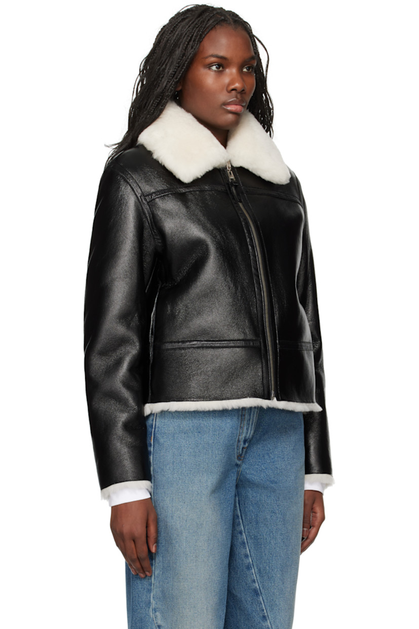 Reversible grained sheepskin jacket. 

Reverse in white shearling. 

· Rated: -15ºC
· Paneled construction 
· Spread collar
· Zip closure
· Seam pockets
· Logo-embossed locker loop at back collar

Supplier color: Black/Natural