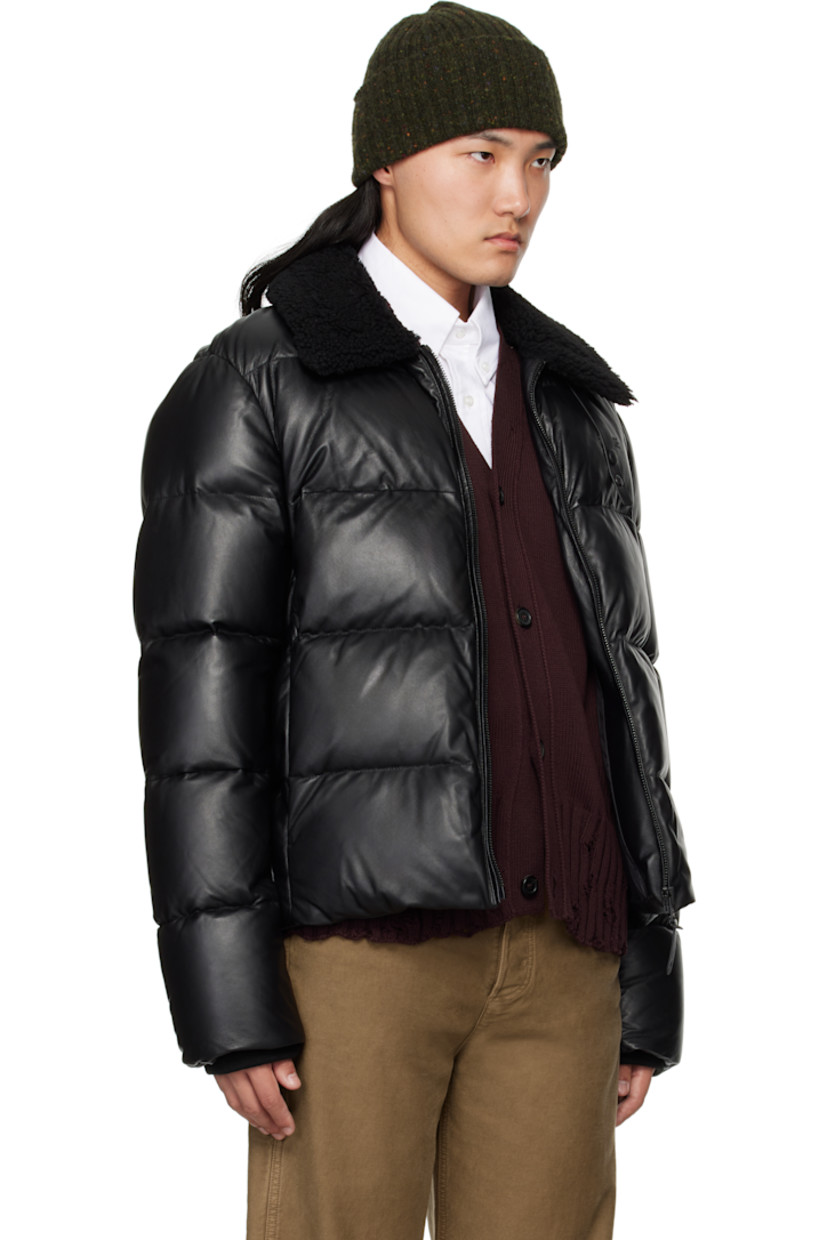 Recycled down-filled and quilted buffed lambskin jacket.

· GRS-certified down
· Rated: -15°C
· Water-repellent
· Press-stud tab at shearling spread collar
· Zip closure
· Logo embossed at chest
· Zip seam pockets
· Inset rib-knit cuffs
· Locker loop at back collar
· Full recycled nylon laqué lining

Supplier color: Black

Fill: 80% recycled down, 20% recycled waterfowl feathers.