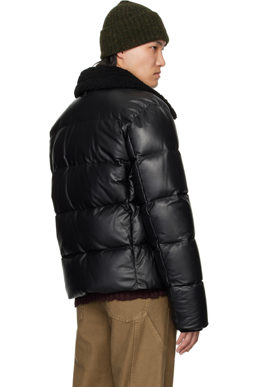 Recycled down-filled and quilted buffed lambskin jacket.

· GRS-certified down
· Rated: -15°C
· Water-repellent
· Press-stud tab at shearling spread collar
· Zip closure
· Logo embossed at chest
· Zip seam pockets
· Inset rib-knit cuffs
· Locker loop at back collar
· Full recycled nylon laqué lining

Supplier color: Black

Fill: 80% recycled down, 20% recycled waterfowl feathers.