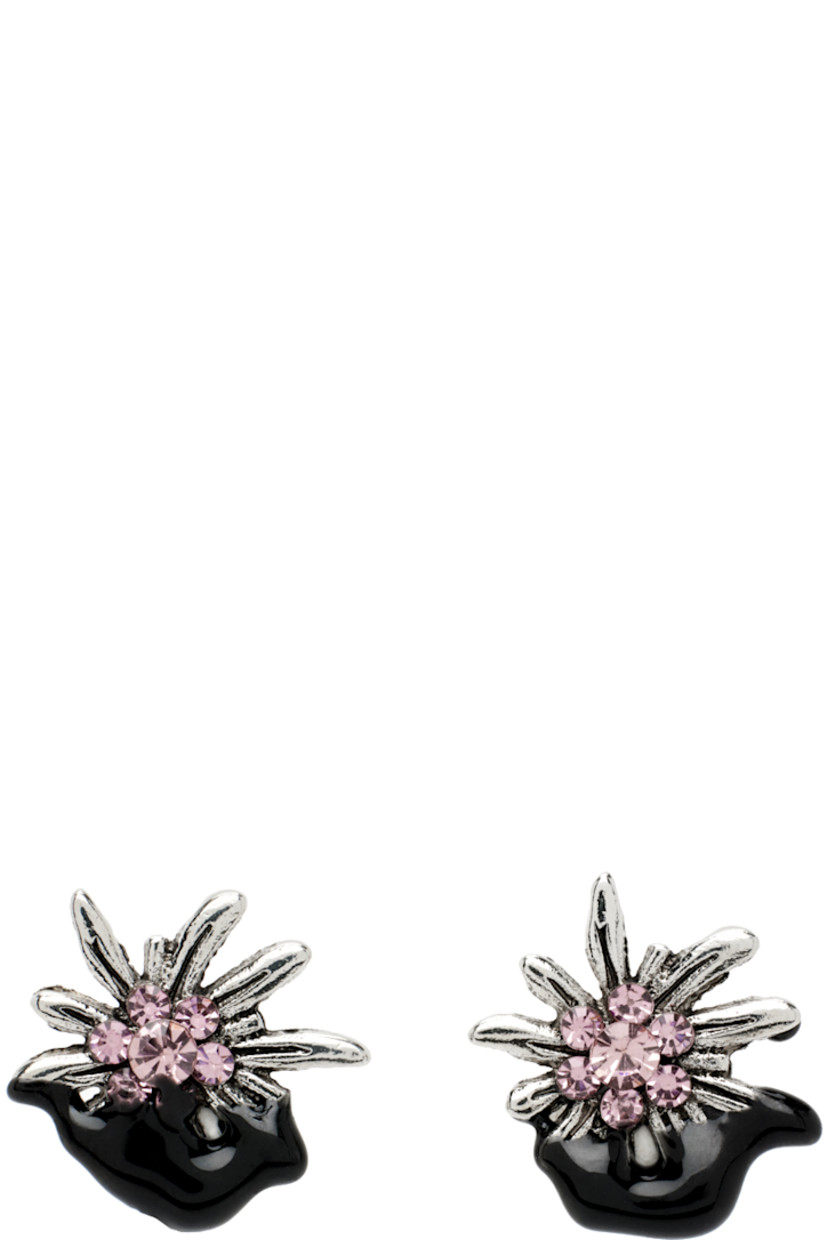 Pair of stud earrings in antiqued silver-tone.

· Graphic with bezel-set crystals at face
· Black rubberized coating
· Post-stud fastening
· D0.75"

Each item is unique. Please note that finishings may vary.

Supplier color: Black