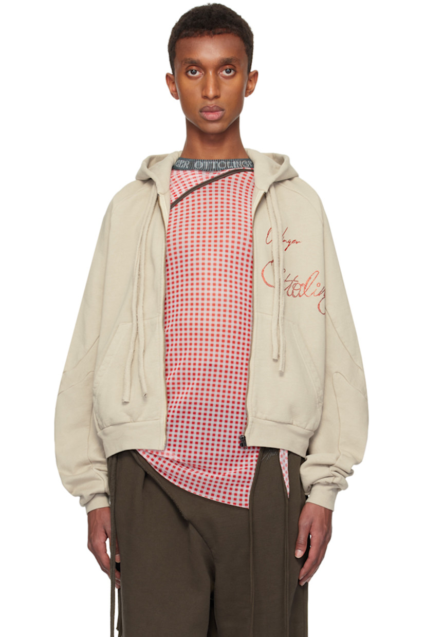 Organic cotton fleece hoodie.

· Drawstring at hood
· Zip closure
· Printed logo and crystal-cut appliqués at front
· Patch pockets
· Rib-knit hem and cuffs
· Raglan sleeves

Supplier color: Sand pebble