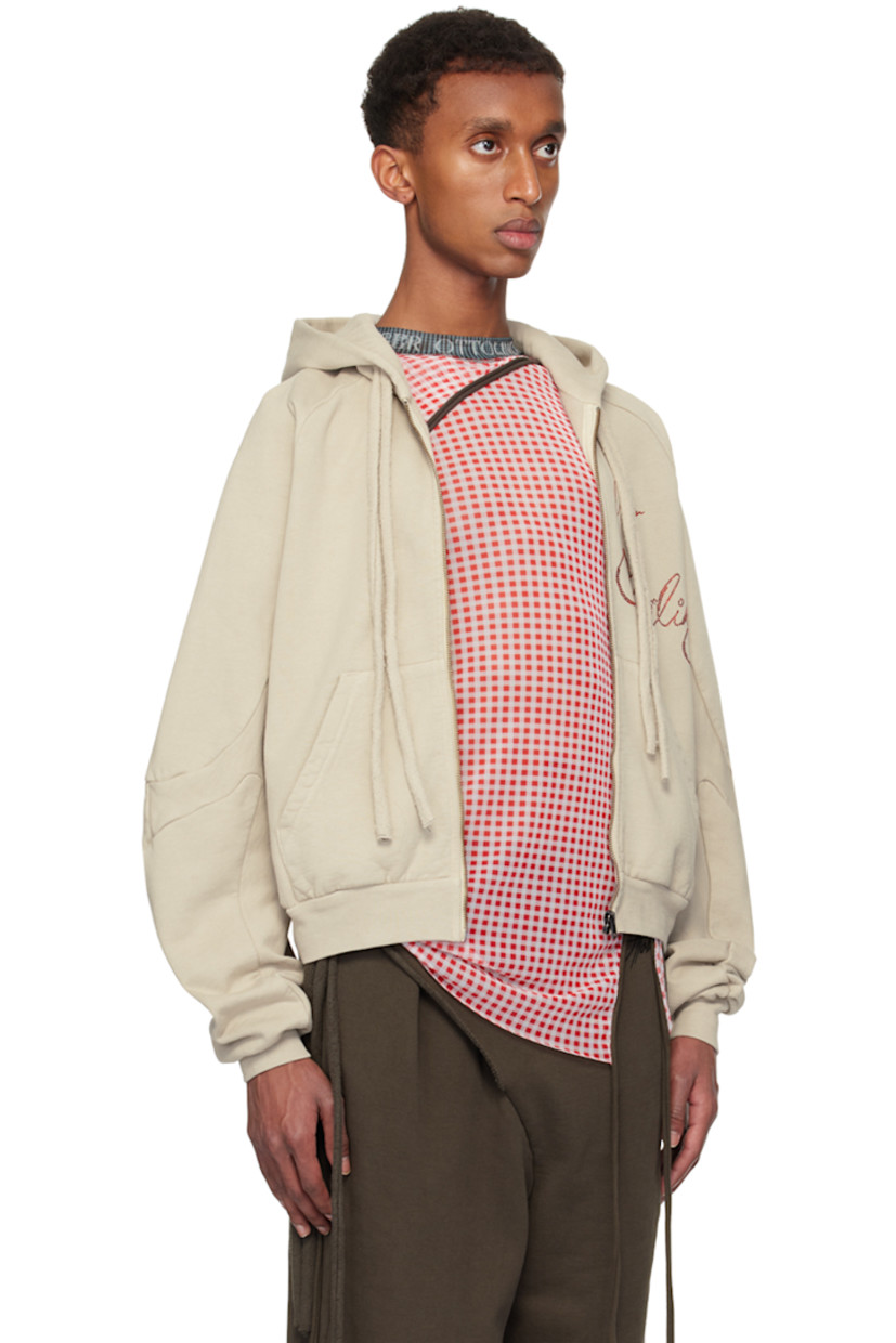 Organic cotton fleece hoodie.

· Drawstring at hood
· Zip closure
· Printed logo and crystal-cut appliqués at front
· Patch pockets
· Rib-knit hem and cuffs
· Raglan sleeves

Supplier color: Sand pebble