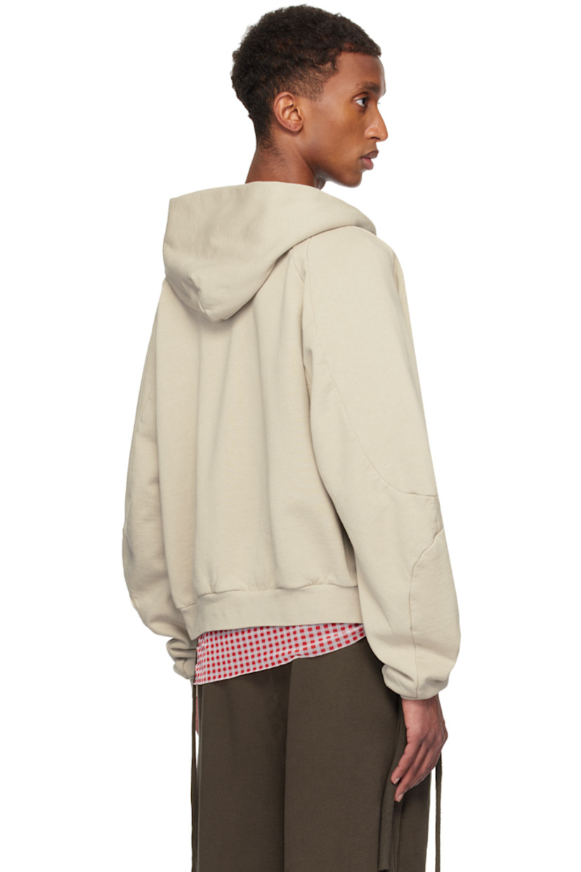 Organic cotton fleece hoodie.

· Drawstring at hood
· Zip closure
· Printed logo and crystal-cut appliqués at front
· Patch pockets
· Rib-knit hem and cuffs
· Raglan sleeves

Supplier color: Sand pebble