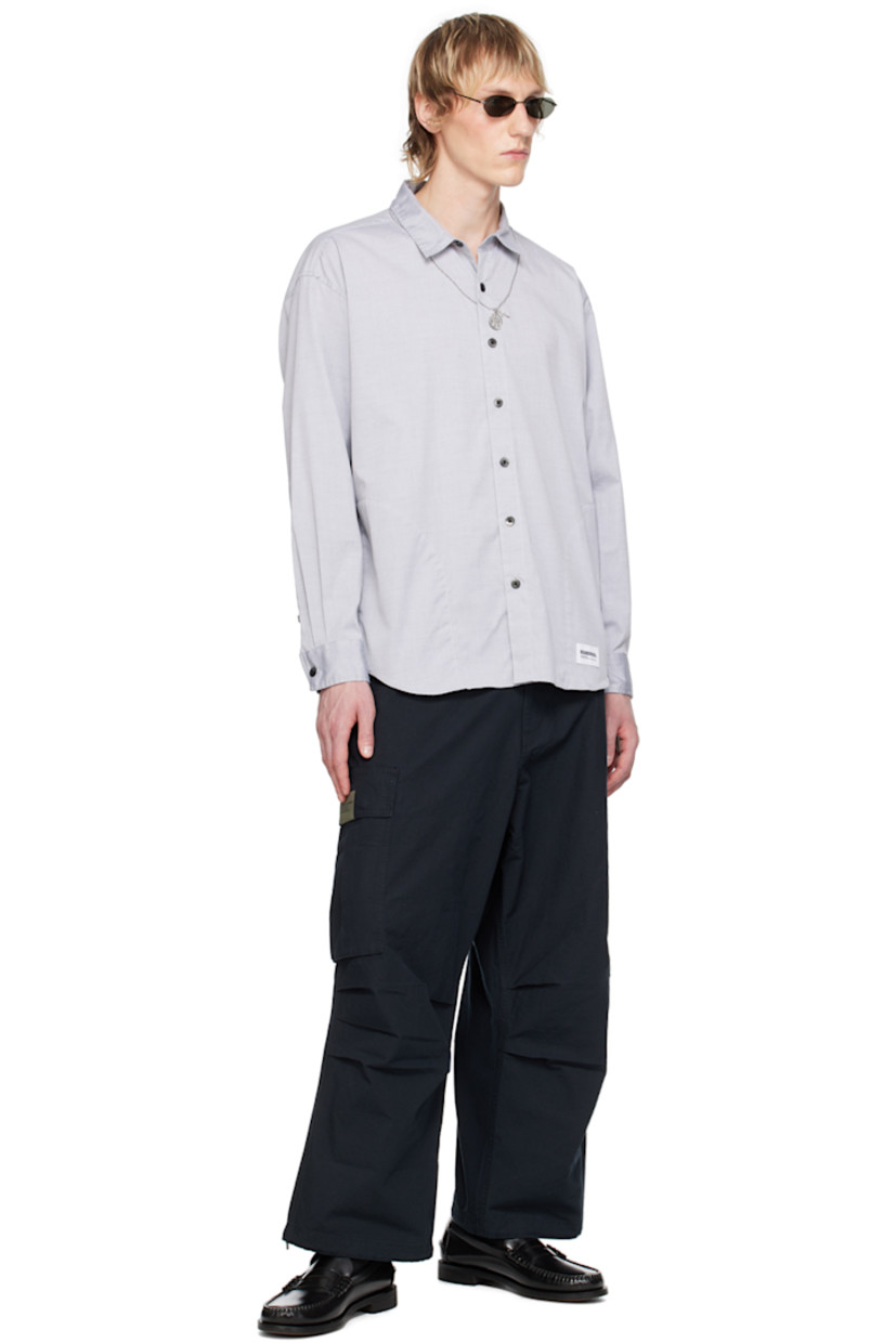 Cotton oxford cloth shirt. 

· Graphic embroidered at spread collar
· Button closure
· Logo patch at shirttail hem
· Seam pockets
· Logo flag at side seam
· Single-button barrel cuffs
· Box pleat at back yoke
· Logo-engraved hardware

Supplier color: Black