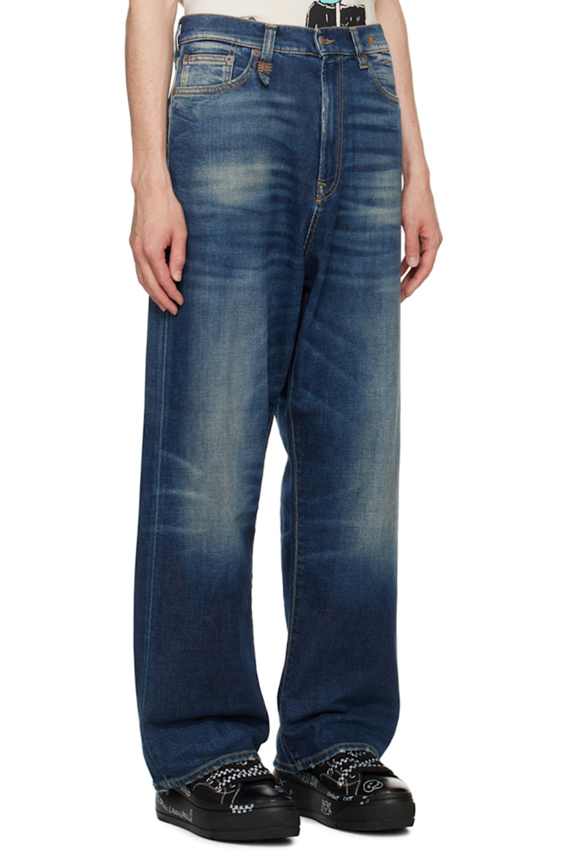 Stretch denim jeans. Fading and whiskering throughout. 

· Belt loops
· Five-pocket styling
· Zip-fly
· Leather logo patch at back waistband
· Logo embroidered at back pocket
· Logo-engraved antiqued silver-tone hardware
· Contrast stitching in tan

Supplier color: Ansel blue