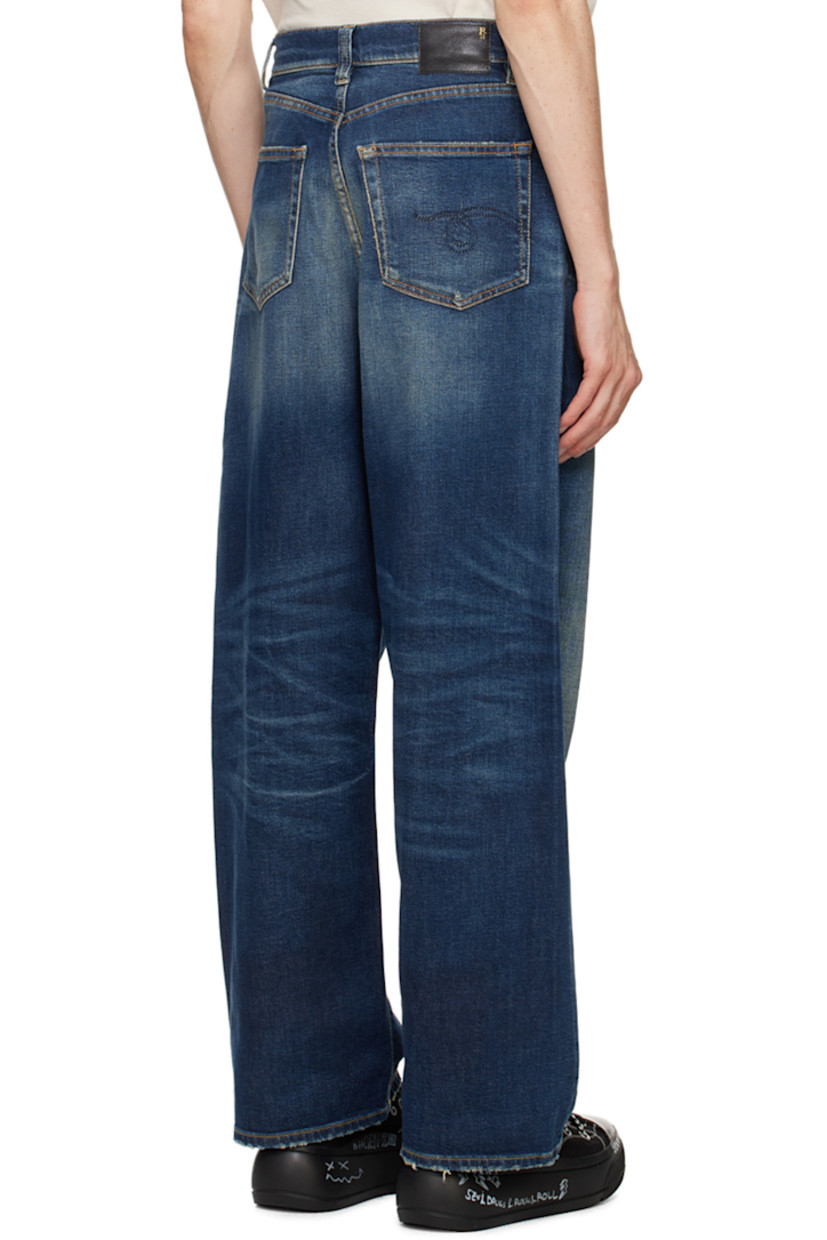 Stretch denim jeans. Fading and whiskering throughout. 

· Belt loops
· Five-pocket styling
· Zip-fly
· Leather logo patch at back waistband
· Logo embroidered at back pocket
· Logo-engraved antiqued silver-tone hardware
· Contrast stitching in tan

Supplier color: Ansel blue