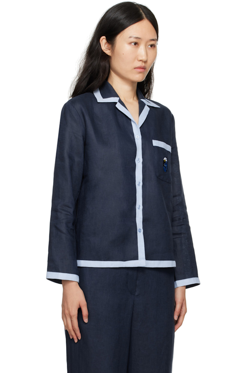 Relaxed-fit linen hopsack shirt.

· Camp collar
· Button closure
· Embroidered logo patch at patch pocket

Supplier color: Navy