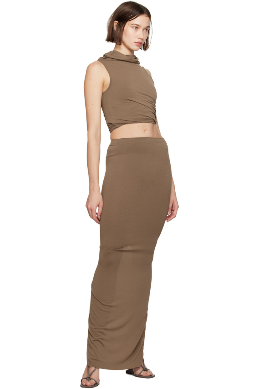 Stretch FSC®-certified viscose-blend crepe jersey maxi skirt.

· Slim-fit and tapered 
· High-rise
· Elasticized waistband
· Raw edge at hem
· Central slit at back

Supplier color: Tan