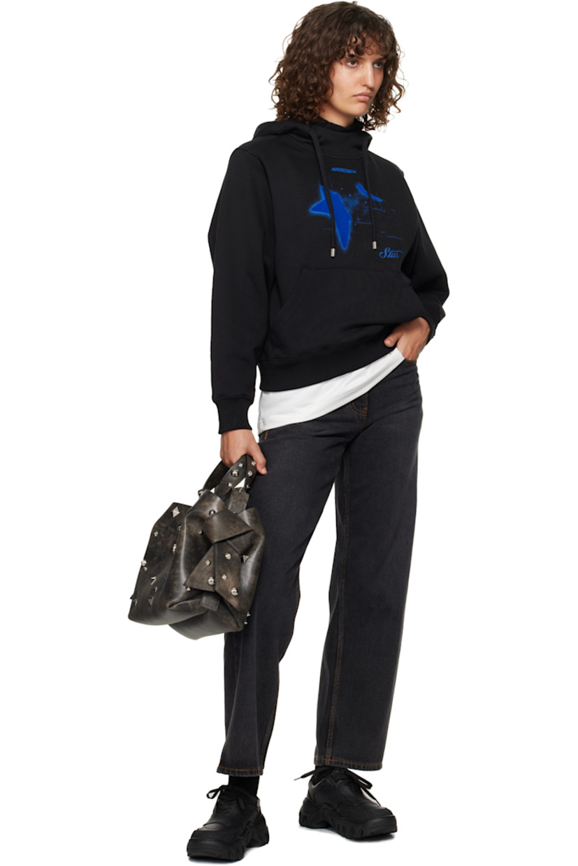 French terry hoodie. 

· Layered construction
· Inset rib-knit mock neck
· Drawstring at hood
· Logo graphic flocked at chest
· Kangaroo pocket
· Rib-knit hem and cuffs
· Dropped shoulders
· Pleat at back sleeves
· Button-style logo appliqués at back
· Logo-engraved silver-tone hardware

Supplier color: Noir