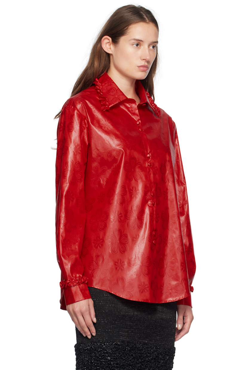 Hand-dyed bazin cotton damask shirt. Jacquard floral pattern throughout. 

· Ruffled trim at spread collar and cuffs
· Button closure
· Shirttail hem
· Single-button barrel cuffs

Supplier color: Red