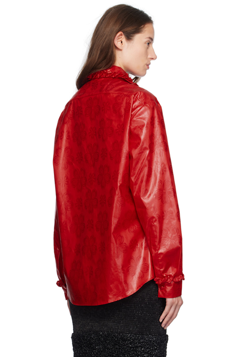 Hand-dyed bazin cotton damask shirt. Jacquard floral pattern throughout. 

· Ruffled trim at spread collar and cuffs
· Button closure
· Shirttail hem
· Single-button barrel cuffs

Supplier color: Red