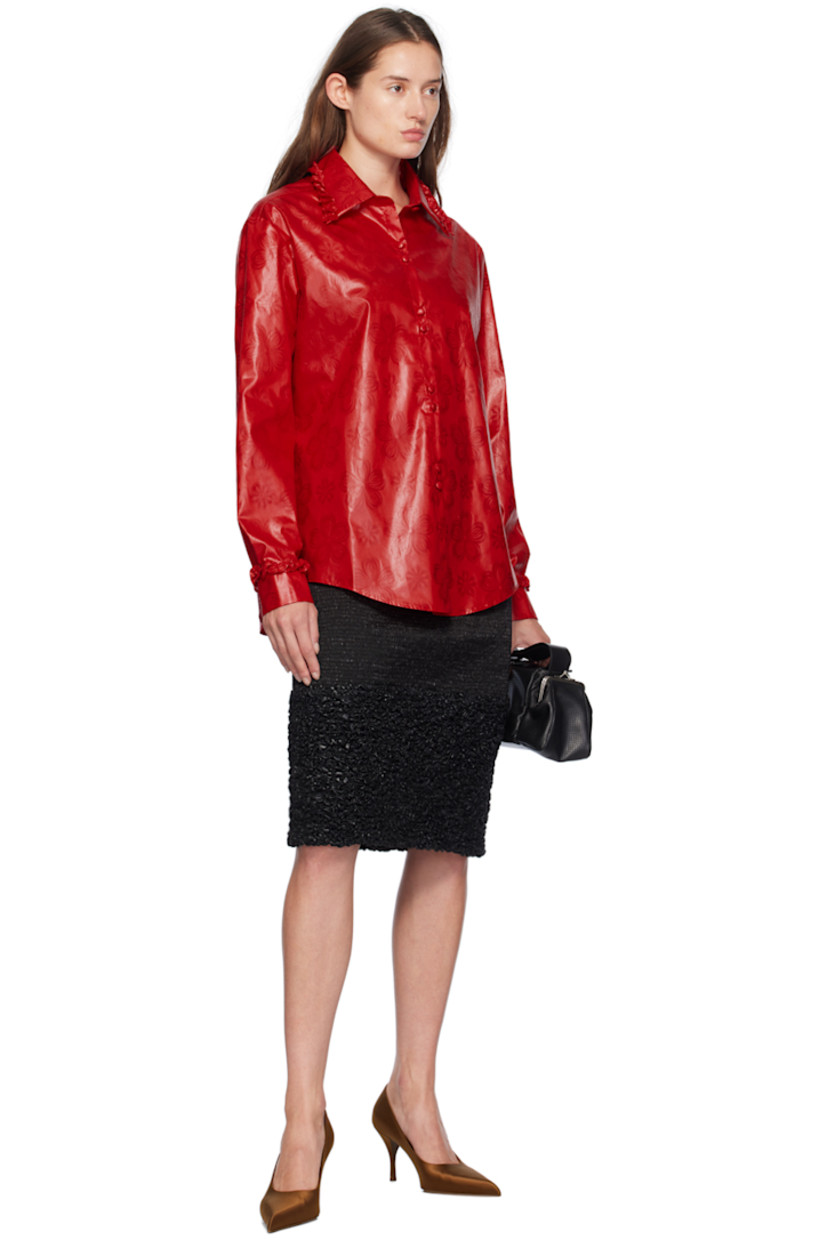Hand-dyed bazin cotton damask shirt. Jacquard floral pattern throughout. 

· Ruffled trim at spread collar and cuffs
· Button closure
· Shirttail hem
· Single-button barrel cuffs

Supplier color: Red