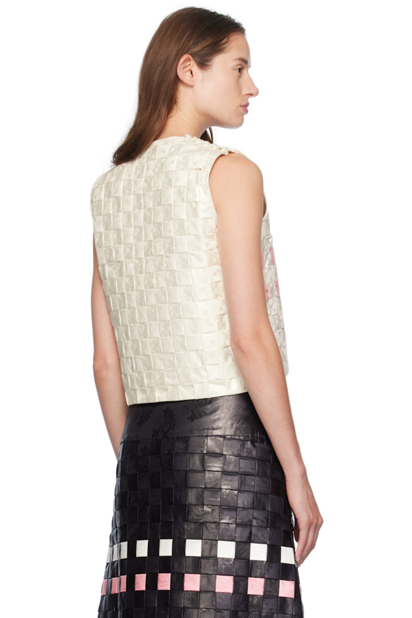 Basket-woven hand-dyed bazin cotton damask tank top. Jacquard graphic pattern throughout. 

· Scoop neck
· Bow accent at chest 
· Button closure at side seam

Supplier color: Off white/Pink