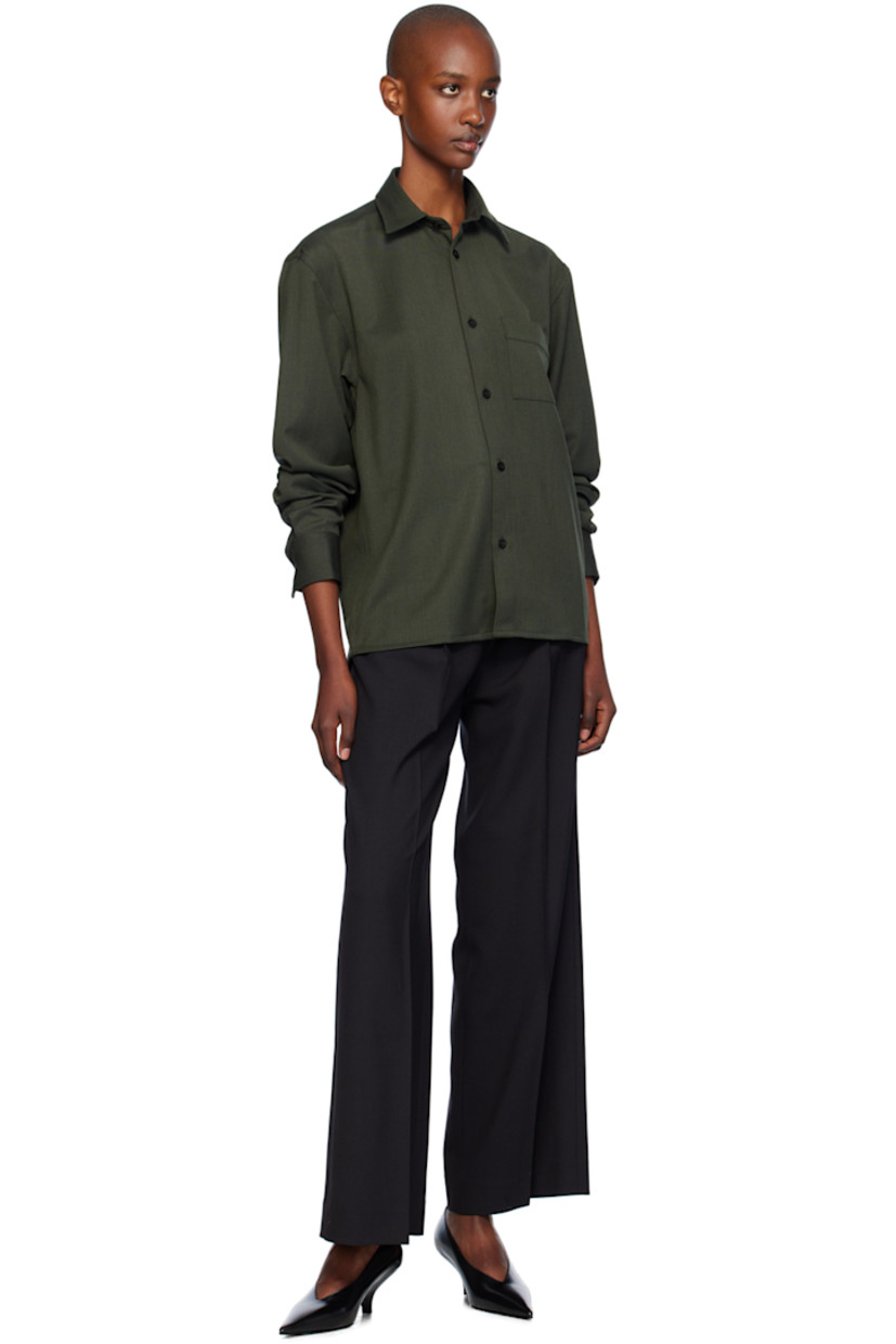 Stretch polyester- and merino wool-blend cavalry twill shirt.

· Boxy-fit
· Spread collar
· Button closure
· Patch pocket
· Adjustable single-button barrel cuffs
· Locker loop at back yoke

Supplier color: Green melange