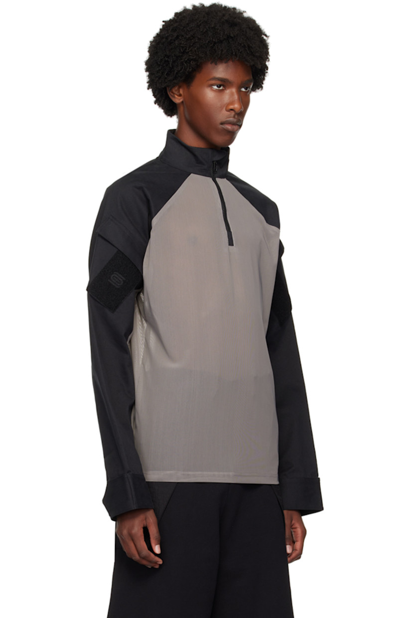 Sheer stretch nylon mesh and cotton twill jacket.

· Paneled construction 
· Stand collar
· Half-zip closure 
· Logo patch and utility pocket at sleeve 
· Velcro tab at cuffs

Supplier color: Grey/Black