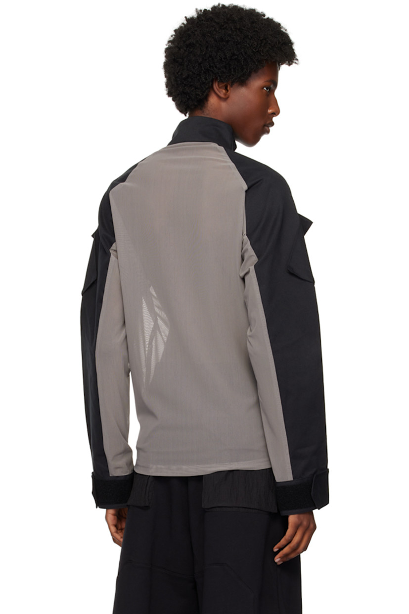 Sheer stretch nylon mesh and cotton twill jacket.

· Paneled construction 
· Stand collar
· Half-zip closure 
· Logo patch and utility pocket at sleeve 
· Velcro tab at cuffs

Supplier color: Grey/Black