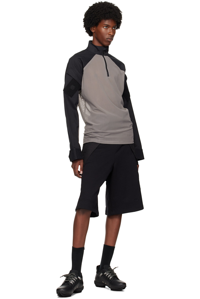 Sheer stretch nylon mesh and cotton twill jacket.

· Paneled construction 
· Stand collar
· Half-zip closure 
· Logo patch and utility pocket at sleeve 
· Velcro tab at cuffs

Supplier color: Grey/Black
