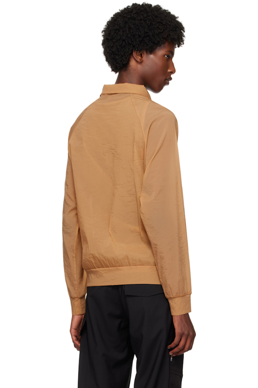 Sheer coated nylon organza jacket.

· Stand collar
· Logo printed at chest
· Zip closure
· Welt pockets
· Raglan sleeves

Supplier color: Champagne