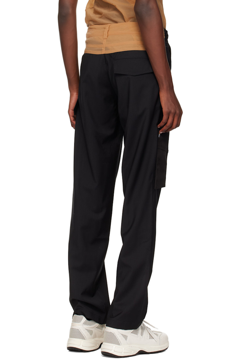 Semi-sheer woven wool and Cordura® nylon organza cargo pants.

· Paneled construction 
· Belt loops
· Button tabs at waistband
· Three-pocket styling
· Zip-fly
· Cargo pockets at leg

Supplier color: Black/Champagne