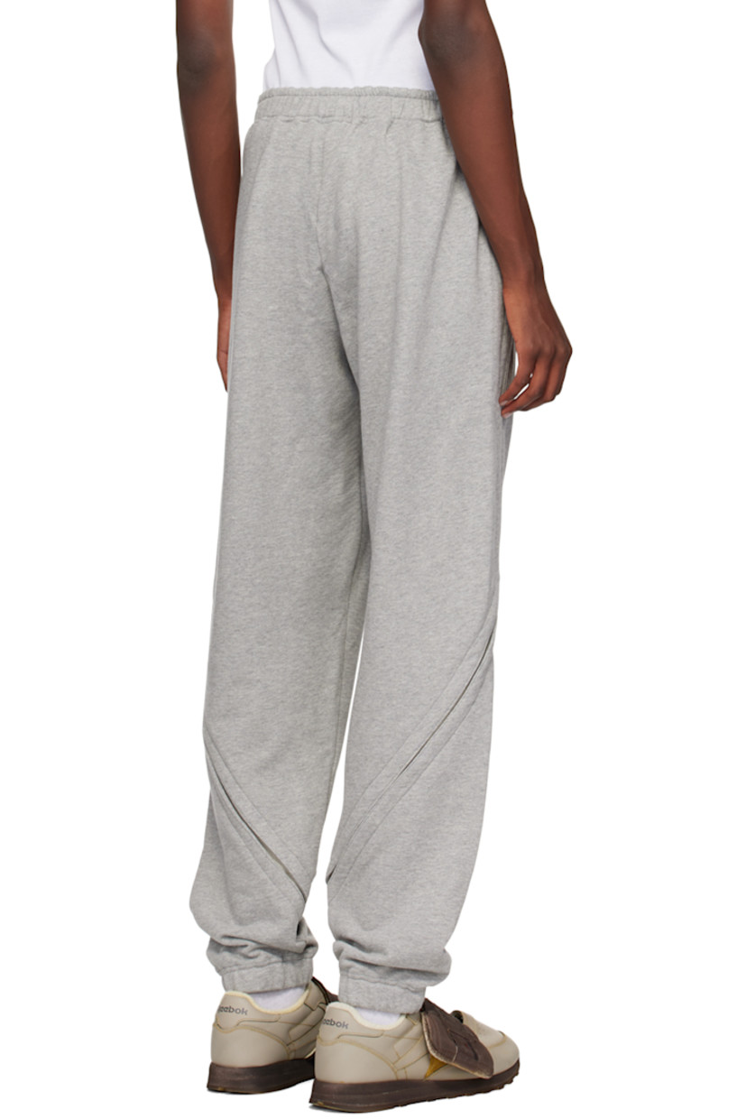 French terry sweatpants.

· Concealed drawstring at elasticized waistband
· Two-pocket styling
· Logo graphic printed at front
· Elasticized cuffs
· Exposed gusset at outseams  

Supplier color: Grey