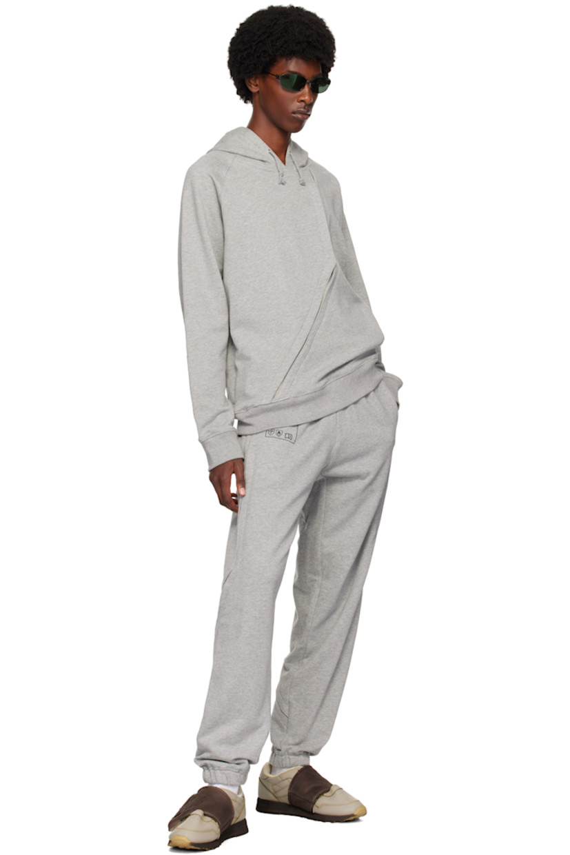 French terry sweatpants.

· Concealed drawstring at elasticized waistband
· Two-pocket styling
· Logo graphic printed at front
· Elasticized cuffs
· Exposed gusset at outseams  

Supplier color: Grey