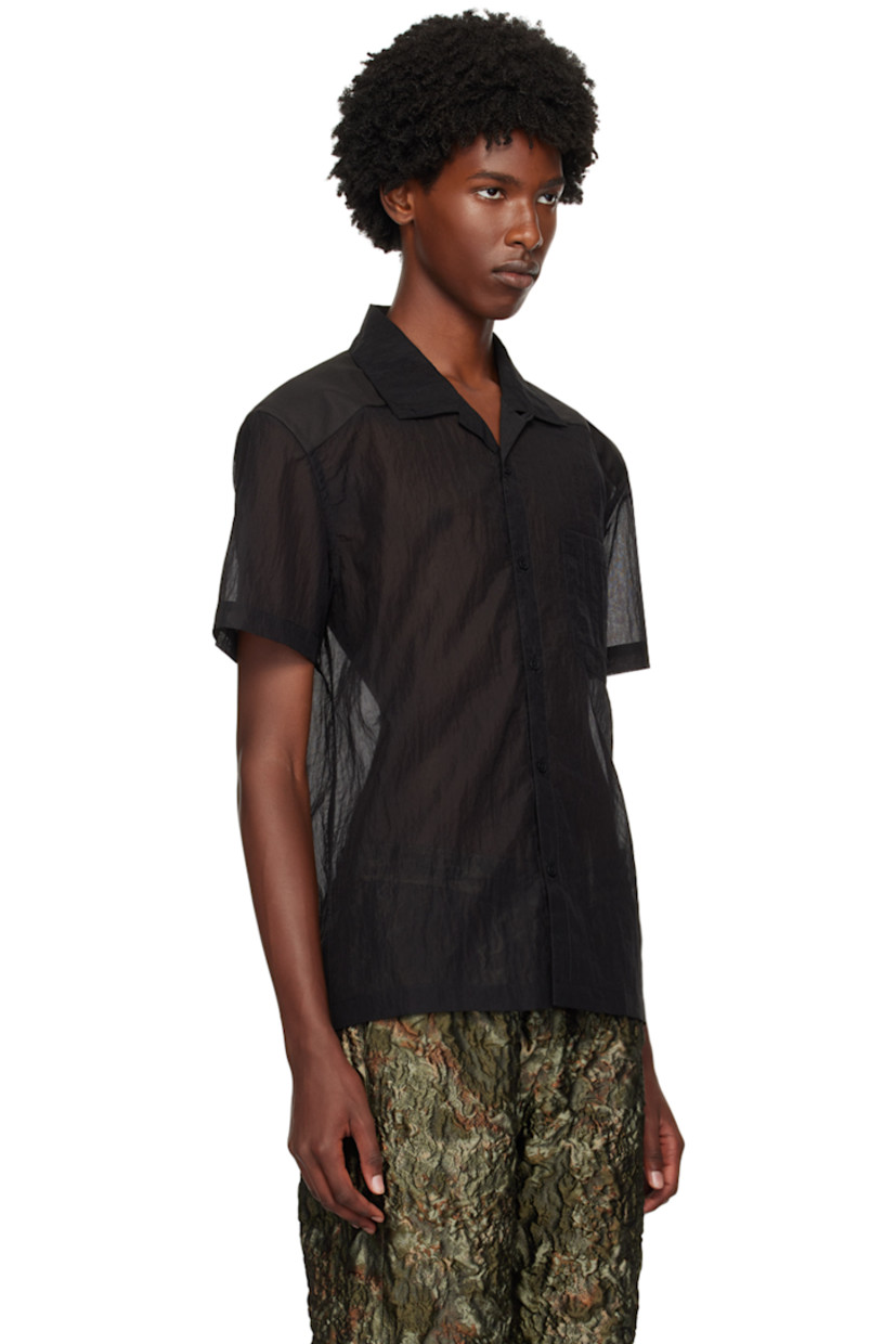 Sheer CORDURA® nylon ripstop and canvas shirt. 

· Paneled construction 
· Button tab at open spread collar 
· Button closure
· Patch pocket
· Logo embroidered at back collar
· Logo patch at back yoke

Supplier color: Black