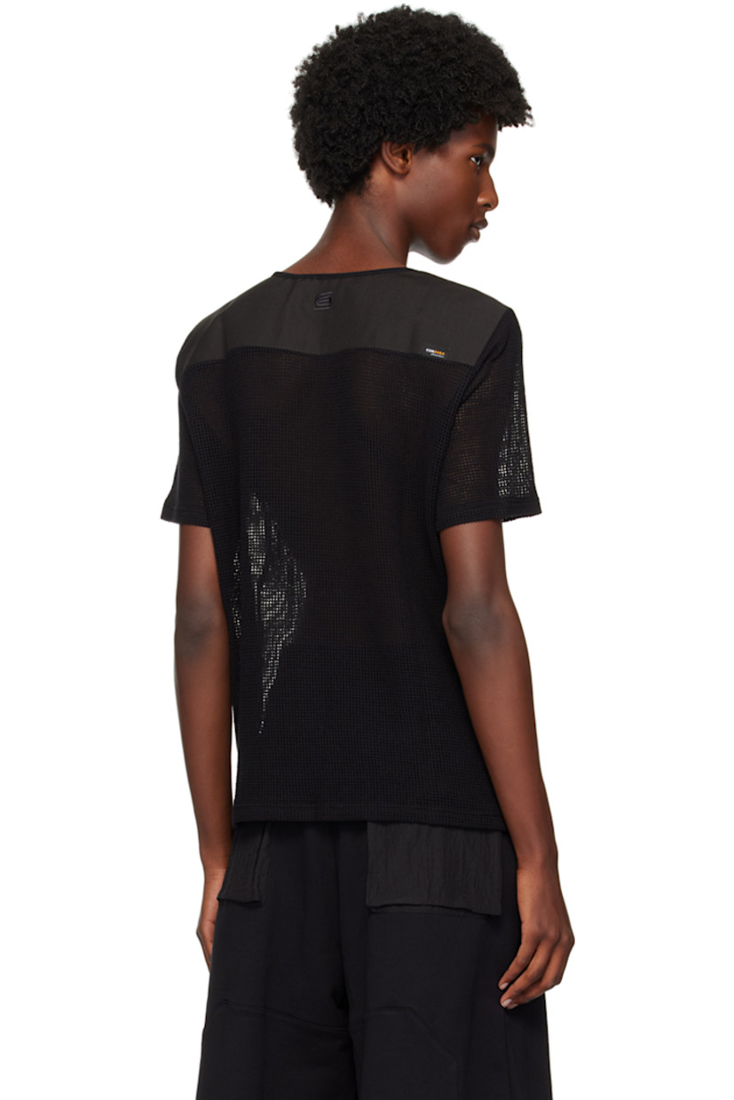 Nylon mesh and canvas T-shirt. 

· Paneled construction 
· Crewneck
· Logo embroidered at back collar
· Logo flag at back yoke

Supplier color: Black