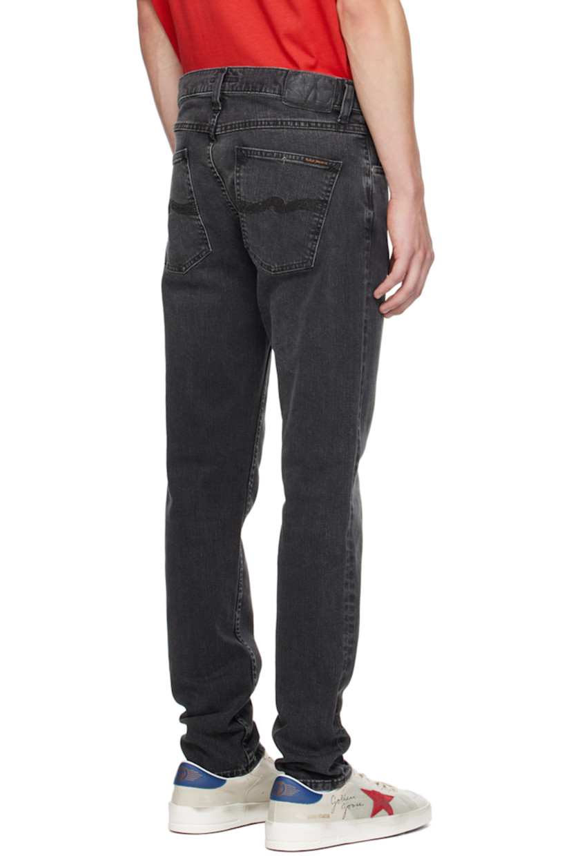 Slim-fit tapered 11.75 oz stretch organic cotton denim jeans. Fading and whiskering throughout. 

· Mid-rise 
· Belt loops 
· Five-pocket styling 
· Zip-fly 
· Jacron logo patch at back waistband 
· Logo patch at back pocket
· Logo-engraved antiqued silver-tone hardware

Supplier color: Black eyes