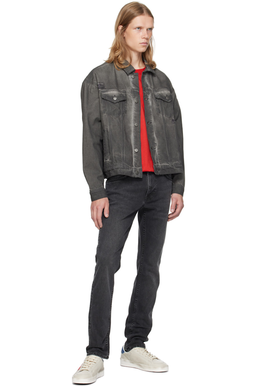 Slim-fit tapered 11.75 oz stretch organic cotton denim jeans. Fading and whiskering throughout. 

· Mid-rise 
· Belt loops 
· Five-pocket styling 
· Zip-fly 
· Jacron logo patch at back waistband 
· Logo patch at back pocket
· Logo-engraved antiqued silver-tone hardware

Supplier color: Black eyes