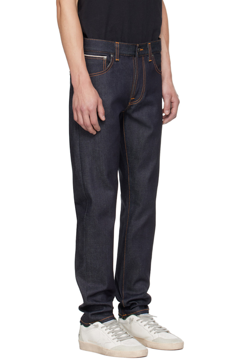 Slim-fit tapered 13 oz stretch organic cotton denim jeans. Subtle fading and whiskering throughout. 

· Mid-rise 
· Belt loops 
· Five-pocket styling 
· Zip-fly 
· Jacron logo patch at back waistband 
· Logo patch at back pocket
· Logo-engraved copper-tone hardware
· Contrast stitching in tan 

Supplier color: Dry Japan Selvage
