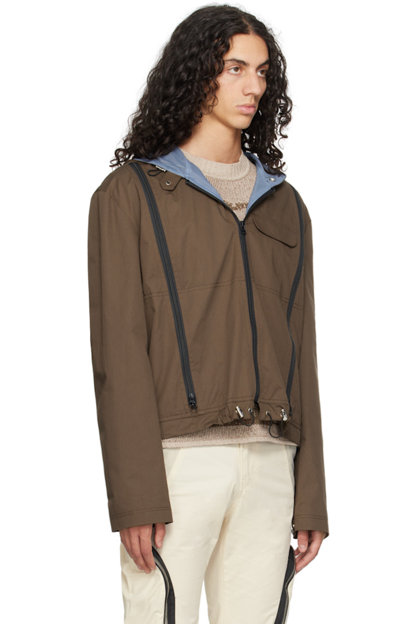 Cotton twill jacket. Two-way zip vents throughout.

· Bungee-style drawstring at hood and hem
· Press-stud tab at hood
· Zip closure
· Flap pocket
· Press-stud tab at cuffs
· Full mesh lining

Supplier color: Fondant brown/Light blue