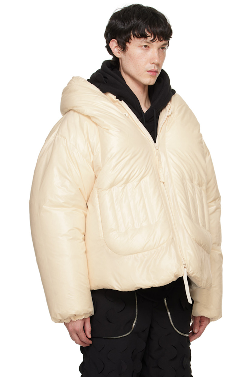 Down-filled polyester taffeta jacket. 

· Bungee-style drawstring at hood
· Stand collar
· Two-way zip closure
· Embroidered detailing at front 
· Zip pockets
· Concealed bungee-style drawstring at hem 
· Elasticized cuffs
· Welt pocket and patch pockets at interior
· Full fleece and taffeta lining

Supplier color: Cream

Fill: 100% goose down.