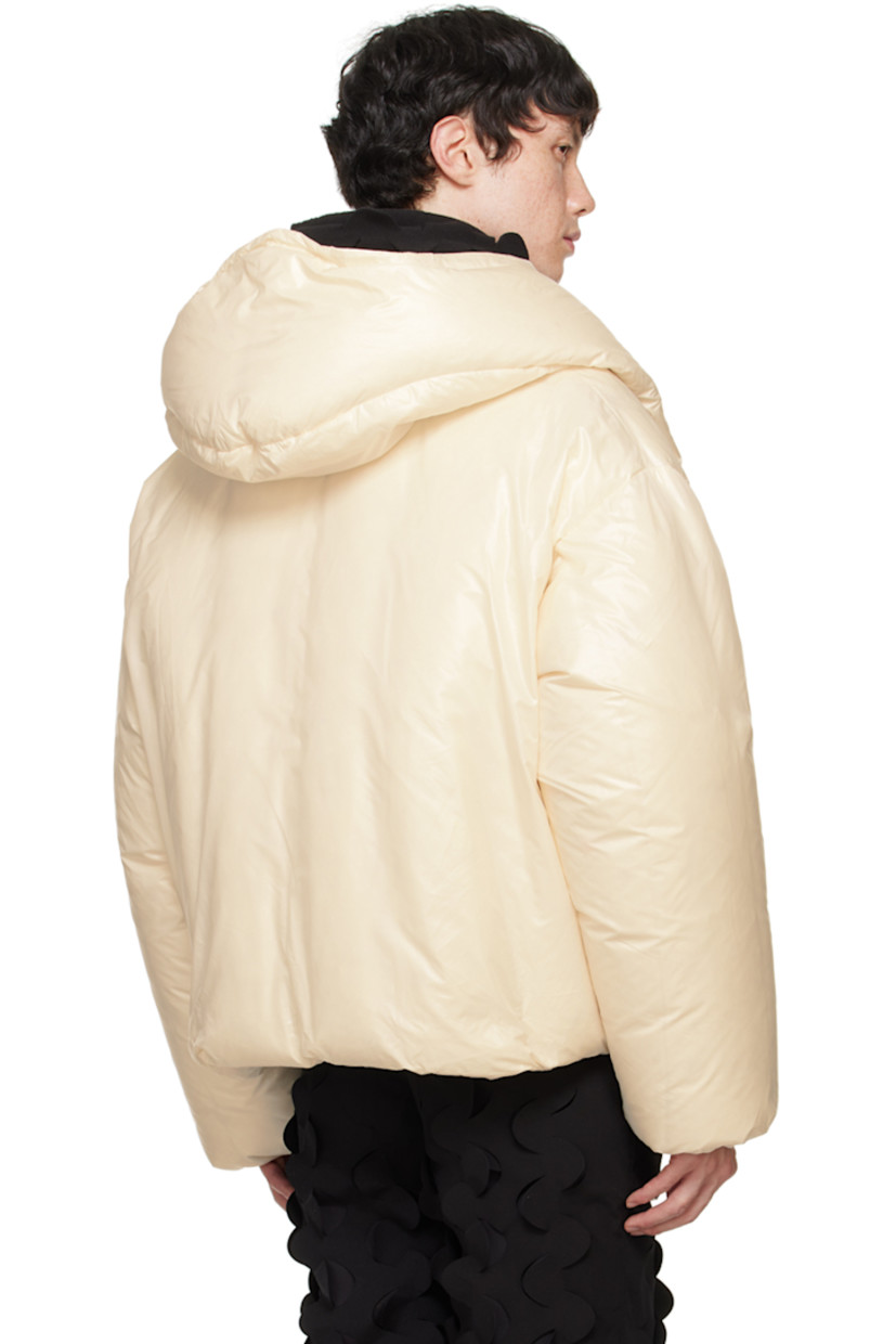 Down-filled polyester taffeta jacket. 

· Bungee-style drawstring at hood
· Stand collar
· Two-way zip closure
· Embroidered detailing at front 
· Zip pockets
· Concealed bungee-style drawstring at hem 
· Elasticized cuffs
· Welt pocket and patch pockets at interior
· Full fleece and taffeta lining

Supplier color: Cream

Fill: 100% goose down.