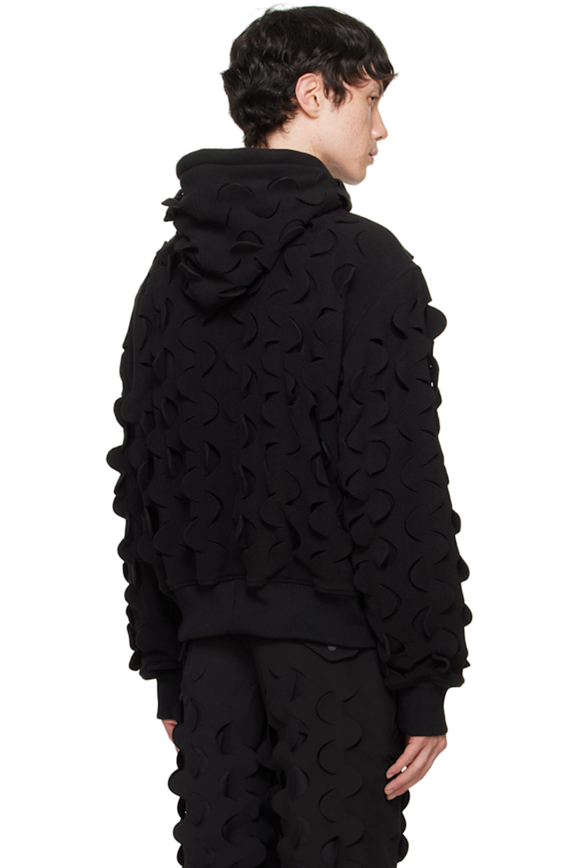 Double-faced polyester fleece hoodie. Laser-cut detailing throughout.

· Drawstring at hood
· Patch pockets
· Logo flag at chest
· Dropped shoulders
· Partial rib knit hem and cuffs

Supplier color: Black