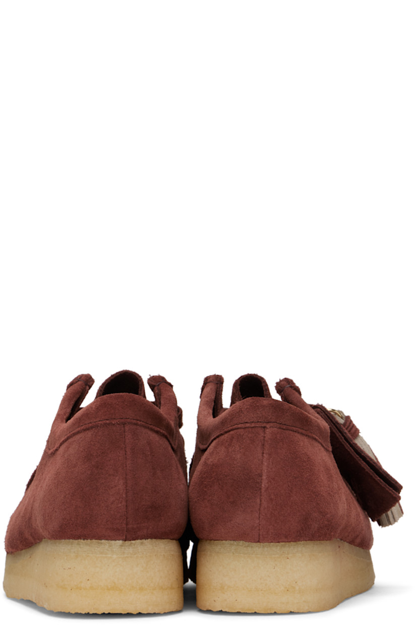 Suede derbys in burgundy.

· Square moc toe
· Logo tags and tassel at lace-up closure
· Bellows tongue
· Suede and grained leather lining
· EVA rubber midsole
· FSC-certified crepe rubber sole
· Includes additional laces in red

Supplier color: Deep red suede