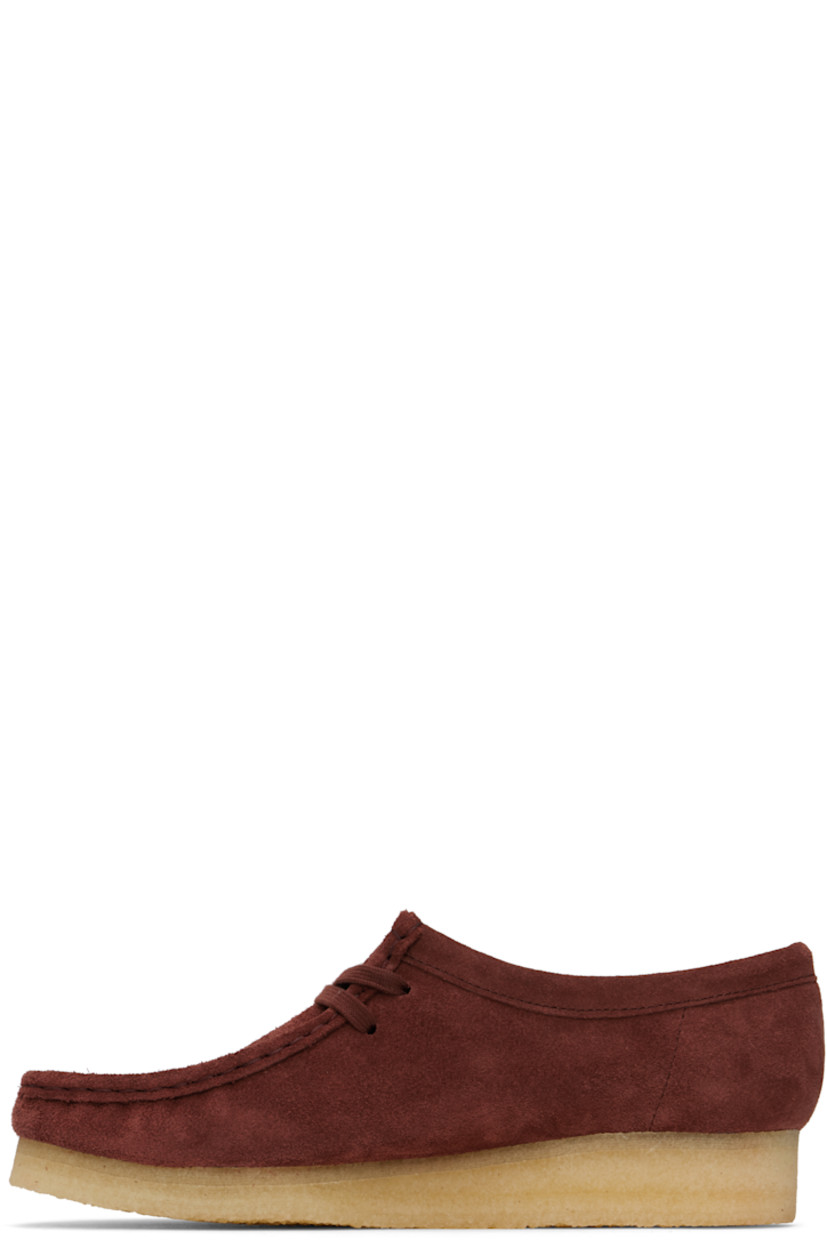 Suede derbys in burgundy.

· Square moc toe
· Logo tags and tassel at lace-up closure
· Bellows tongue
· Suede and grained leather lining
· EVA rubber midsole
· FSC-certified crepe rubber sole
· Includes additional laces in red

Supplier color: Deep red suede