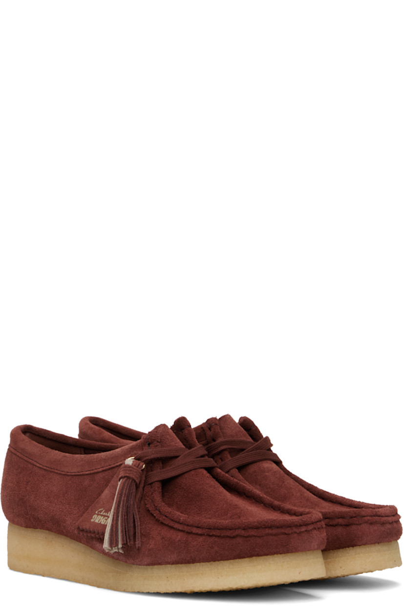 Suede derbys in burgundy.

· Square moc toe
· Logo tags and tassel at lace-up closure
· Bellows tongue
· Suede and grained leather lining
· EVA rubber midsole
· FSC-certified crepe rubber sole
· Includes additional laces in red

Supplier color: Deep red suede