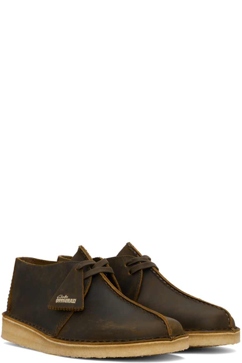 Waxed leather derbys in brown.

· Pinched seam at vamp
· Logo tags at lace-up closure
· Graphic embossed at heel counter
· Suede lining
· EVA rubber midsole
· FSC-certified crepe rubber sole
· Includes additional laces in orange

Supplier color: Beeswax