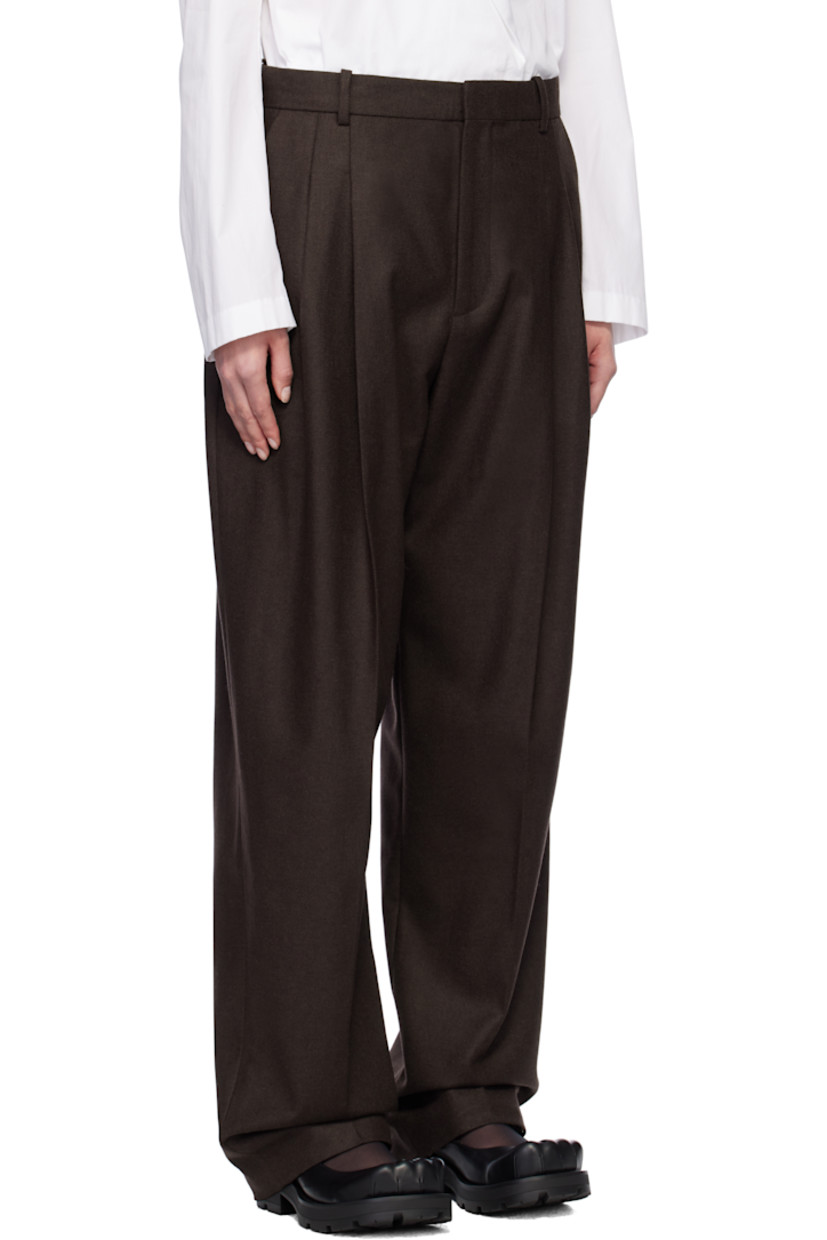 Loose-fit wool-blend twill trousers. 

· Belt loops
· Three-pocket styling
· Zip-fly
· Pleats at front
· Creased legs
· Darts at back waistband
· Knit cotton trim at back pocket
· Unlined

Supplier color: Brown