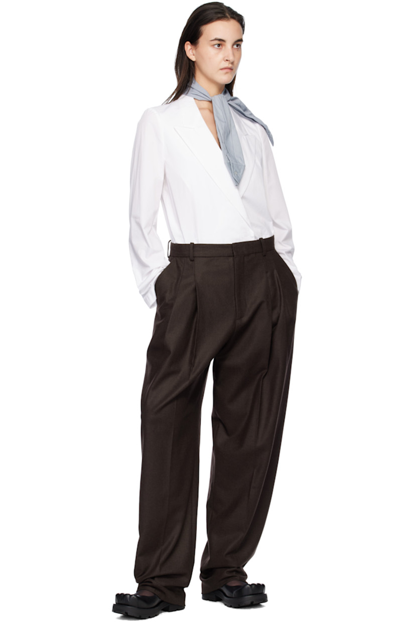 Loose-fit wool-blend twill trousers. 

· Belt loops
· Three-pocket styling
· Zip-fly
· Pleats at front
· Creased legs
· Darts at back waistband
· Knit cotton trim at back pocket
· Unlined

Supplier color: Brown