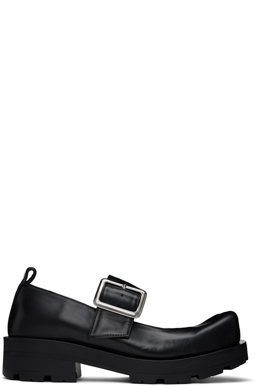 Buffed leather Mary Jane-style loafers in black.

· Sculptural square toe
· Pin-buckle strap at vamp
· Pull-loop at heel
· Cushioned insole
· Buffed leather lining
· Rubber block heel
· Treaded rubber sole
· Heel: H1.75"

Supplier color: Black