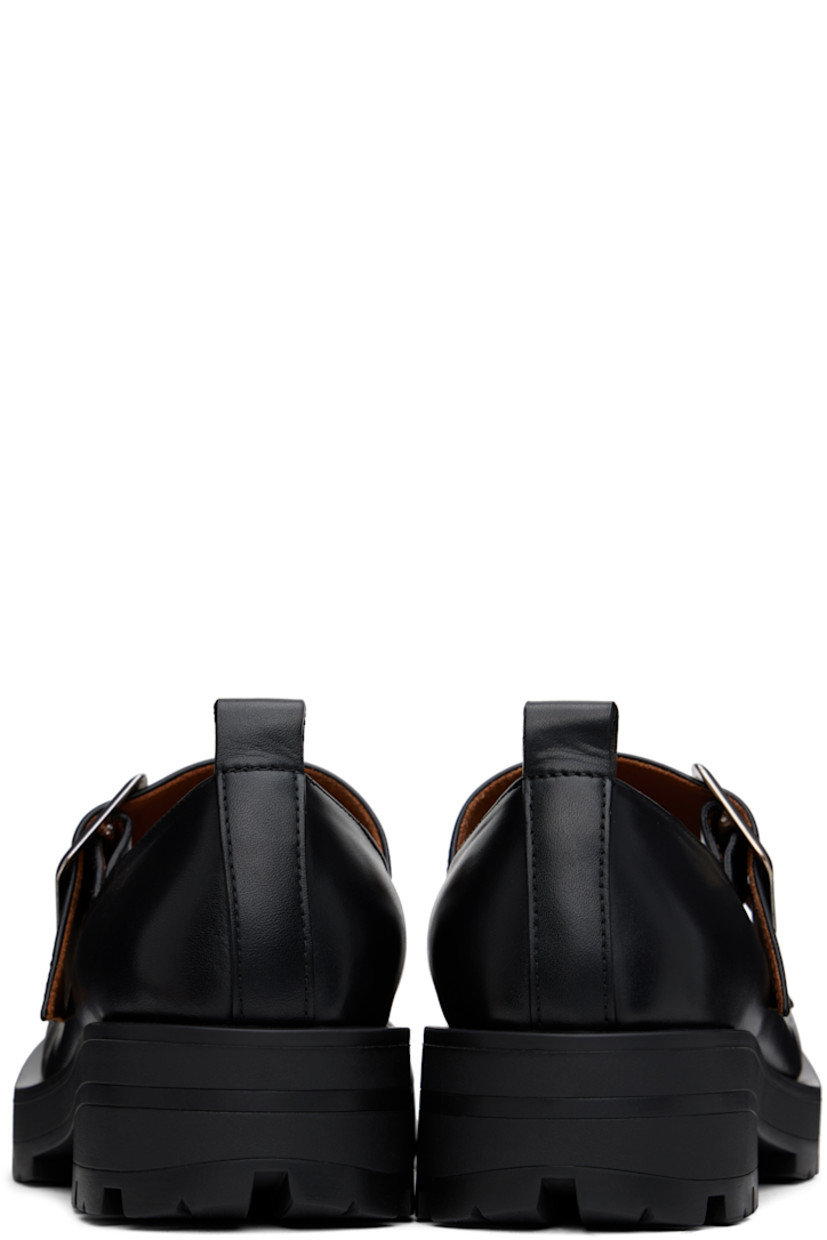 Buffed leather Mary Jane-style loafers in black.

· Sculptural square toe
· Pin-buckle strap at vamp
· Pull-loop at heel
· Cushioned insole
· Buffed leather lining
· Rubber block heel
· Treaded rubber sole
· Heel: H1.75"

Supplier color: Black