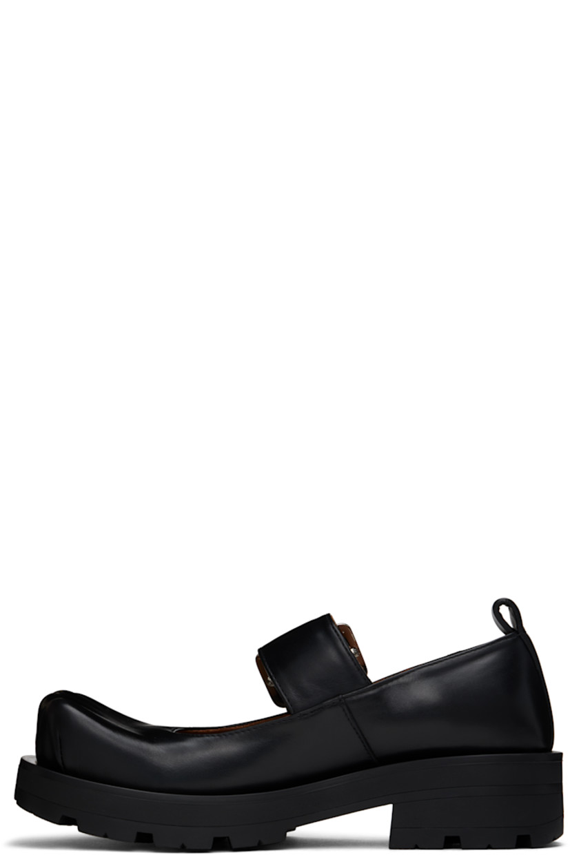 Buffed leather Mary Jane-style loafers in black.

· Sculptural square toe
· Pin-buckle strap at vamp
· Pull-loop at heel
· Cushioned insole
· Buffed leather lining
· Rubber block heel
· Treaded rubber sole
· Heel: H1.75"

Supplier color: Black