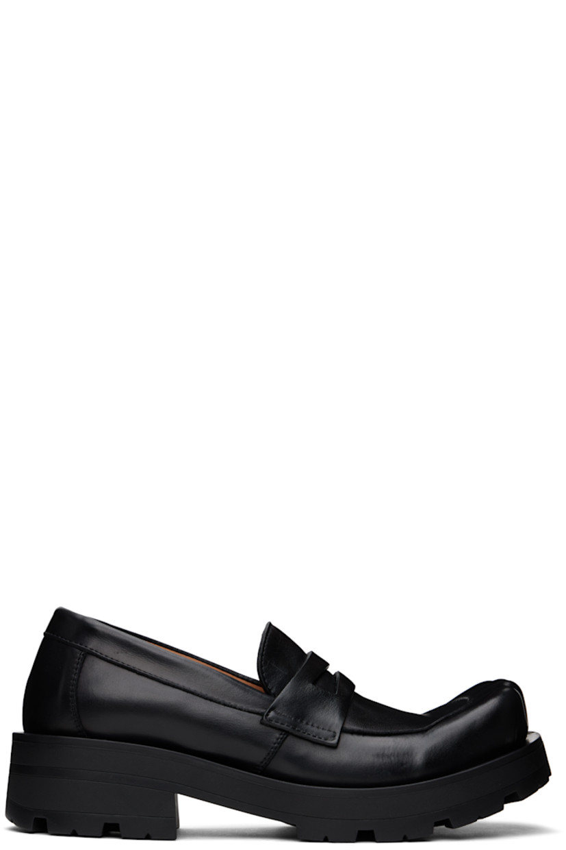 Buffed leather loafers in black.

· Sculptural square moc toe
· Strap with cutout at vamp
· Cushioned insole
· Buffed leather lining
· Rubber block heel
· Treaded rubber sole
· Heel: H1.75"

Supplier color: Black