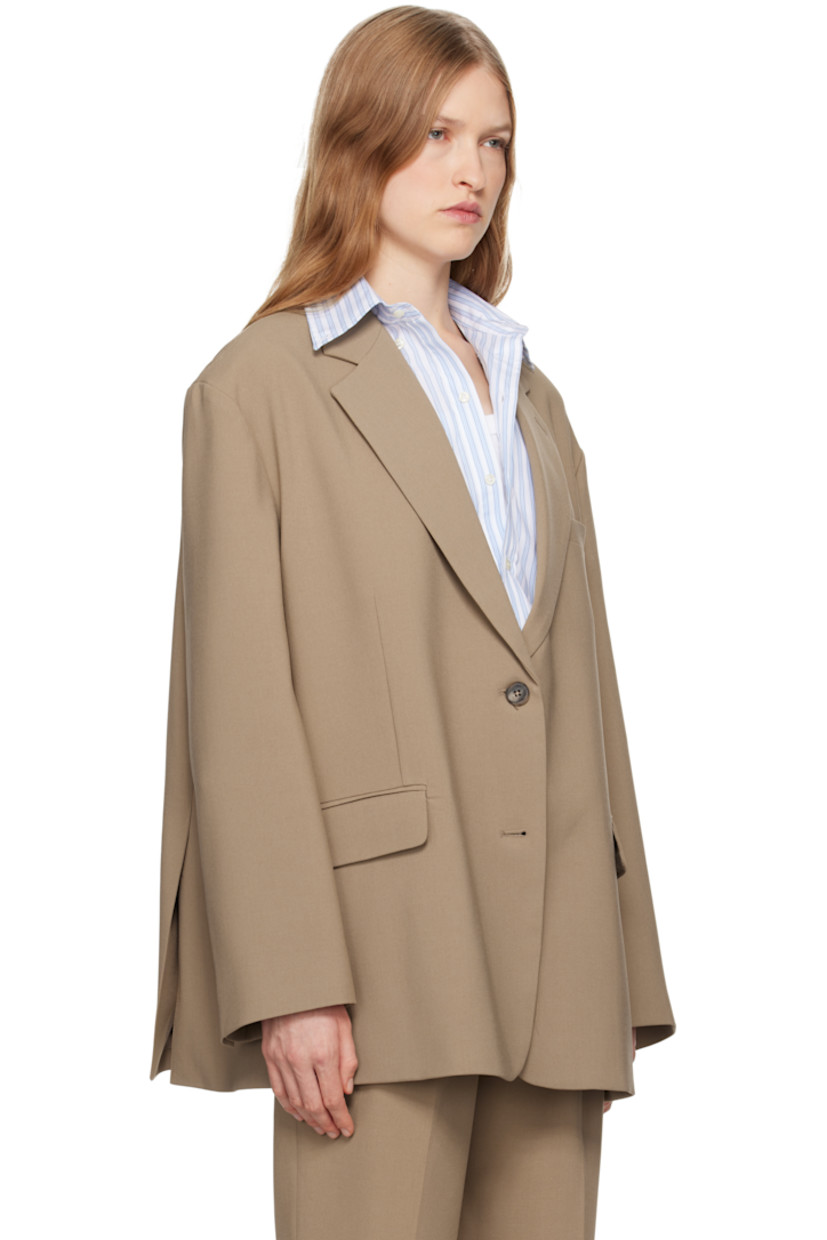 Oversized stretch polyester twill blazer.

· Notched lapel
· Two-button closure
· Welt pocket and flap pockets
· Dropped shoulders
· Four-button surgeon's cuffs
· Twin vents at back hem
· Full satin lining
· Logo-engraved horn hardware

Supplier color: Latte