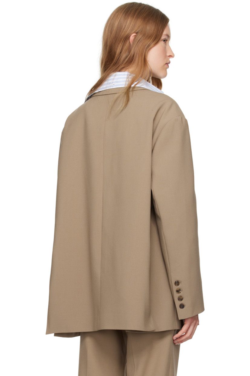 Oversized stretch polyester twill blazer.

· Notched lapel
· Two-button closure
· Welt pocket and flap pockets
· Dropped shoulders
· Four-button surgeon's cuffs
· Twin vents at back hem
· Full satin lining
· Logo-engraved horn hardware

Supplier color: Latte