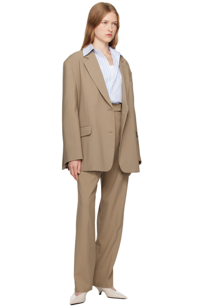 Oversized stretch polyester twill blazer.

· Notched lapel
· Two-button closure
· Welt pocket and flap pockets
· Dropped shoulders
· Four-button surgeon's cuffs
· Twin vents at back hem
· Full satin lining
· Logo-engraved horn hardware

Supplier color: Latte