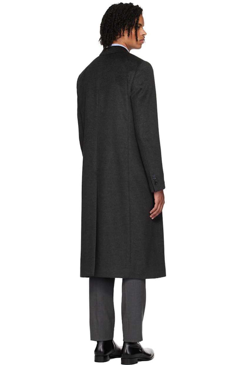 Virgin wool- and alpaca blend twill coat.

· Peaked lapel
· Double-breasted button closure
· Welt pockets
· Four-button surgeon's cuffs
· Central vent at back hem
· Welt pockets at interior 
· Full viscose-blend satin lining

Supplier color: Black