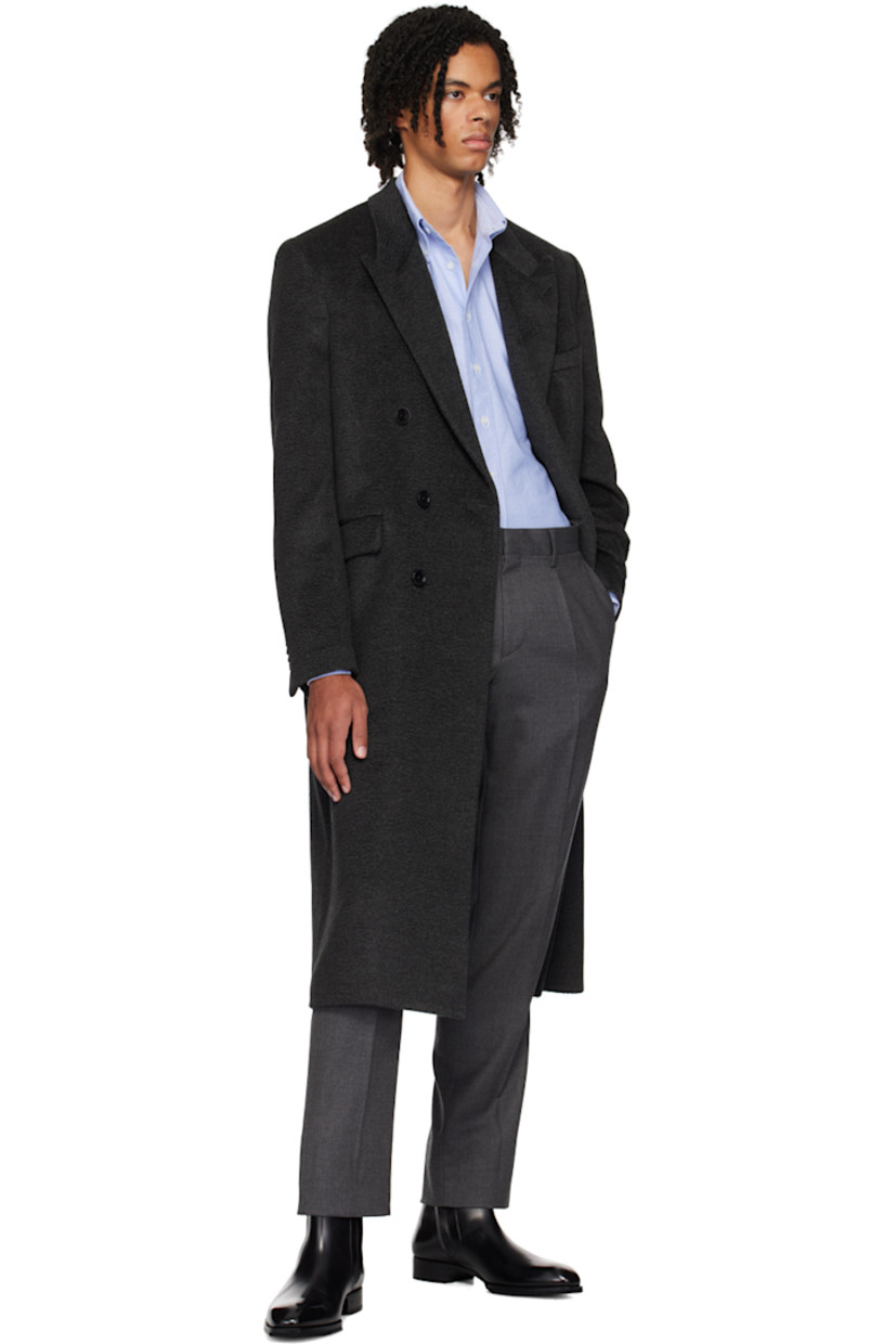 Virgin wool- and alpaca blend twill coat.

· Peaked lapel
· Double-breasted button closure
· Welt pockets
· Four-button surgeon's cuffs
· Central vent at back hem
· Welt pockets at interior 
· Full viscose-blend satin lining

Supplier color: Black